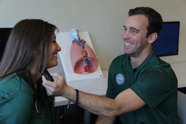 Two students practicing speech therapy. 